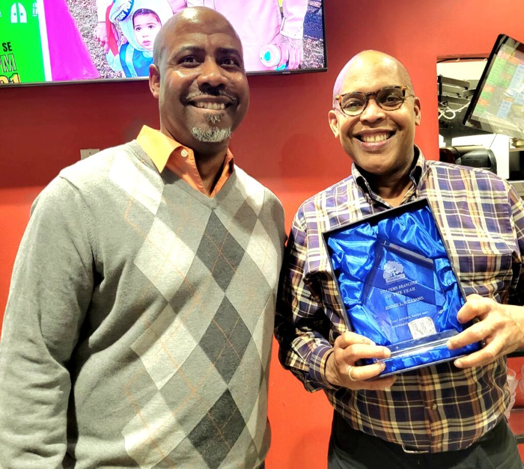 Current PBCA President Paul Grant presents the '2024 Penn Brancher of the Year Award' to Jimmie Williams, Former PBCA President, and current Ward 7 Democratic Committee representative.